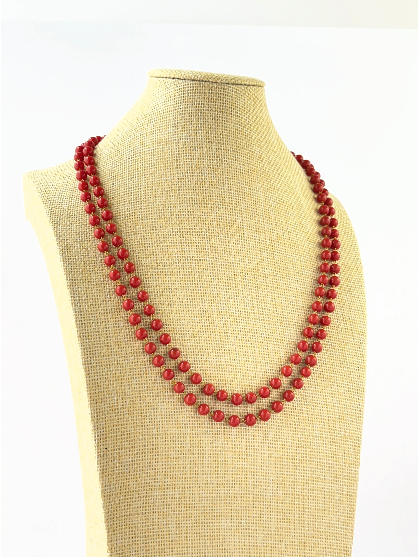 Elegant two‑strand Taiwan coral necklace showcasing smooth round beads.