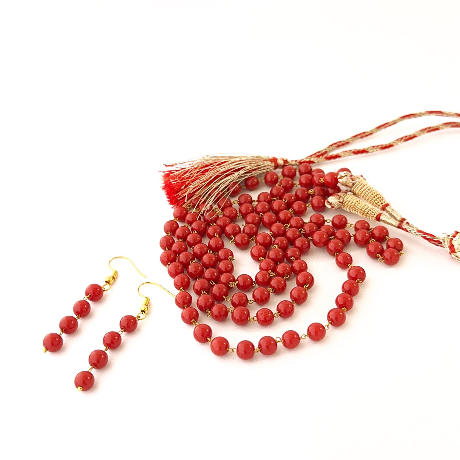 Taiwan coral necklace with smooth round 6mm beads and adjustable closure.
