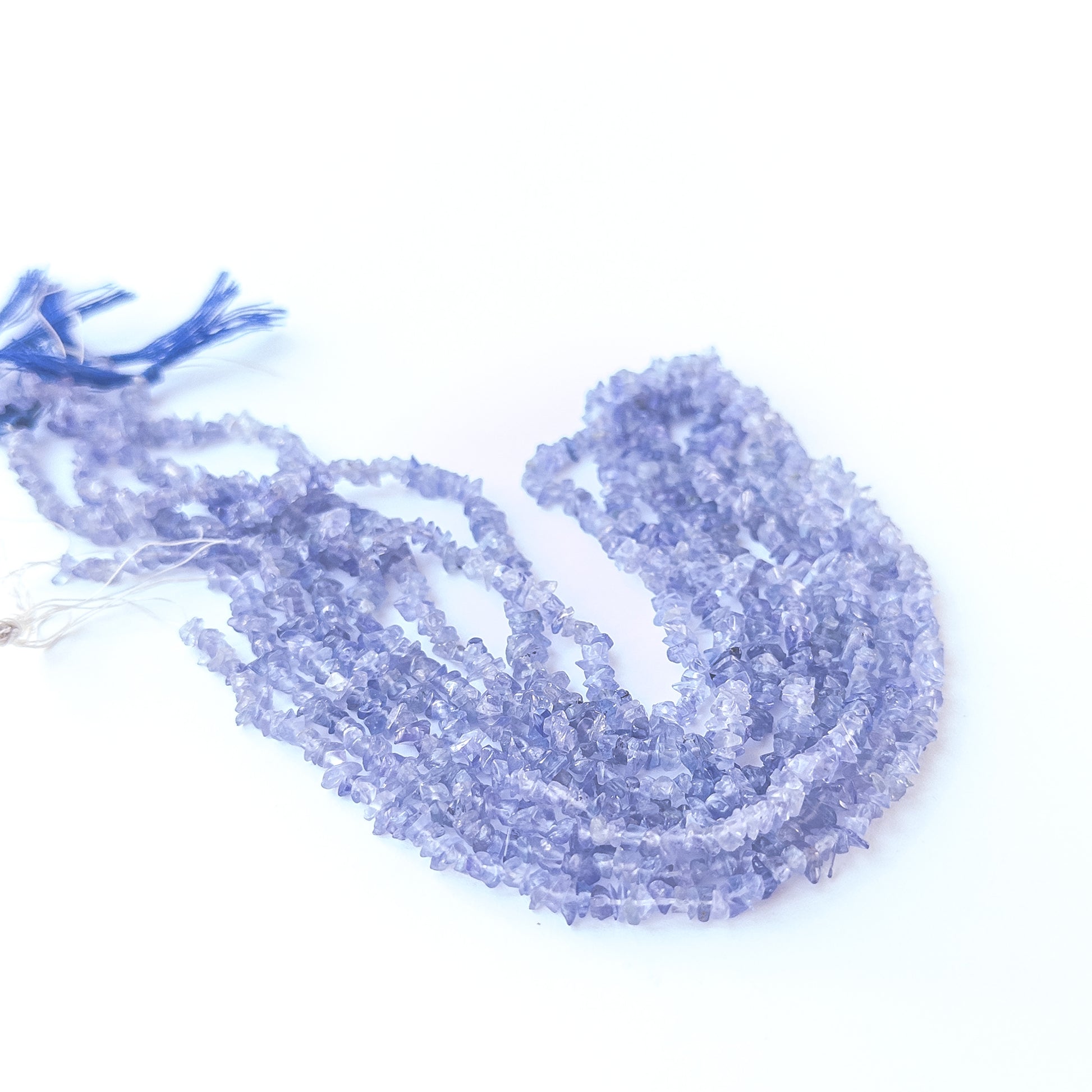 Genuine Tanzanite stone beads for DIY jewellery featuring natural chip shaping and shimmering blue‑purple tones.