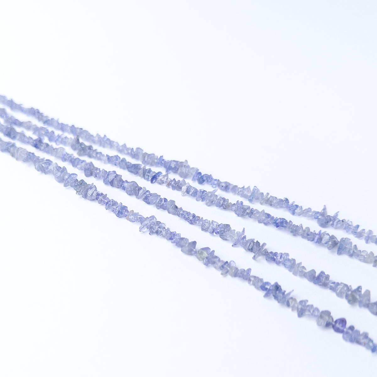 Close‑up of Tanzanite chip beads revealing texture, shine and fine craftsmanship.