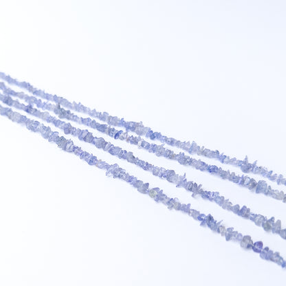 Close‑up of Tanzanite chip beads revealing texture, shine and fine craftsmanship.