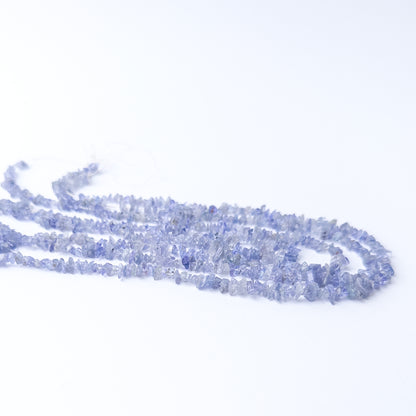 Authentic Tanzanite gemstone beads displaying raw texture and bright blue‑violet shine.