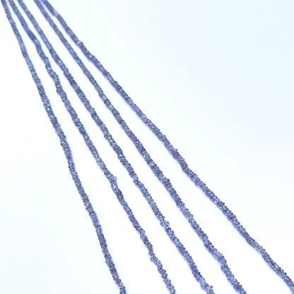 Faceted tanzanite beads with fine rondelles arranged in an elegant layout.