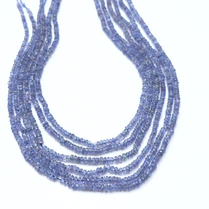 Tanzanite strand featuring faceted rondelle beads with soft violet‑blue sparkle.