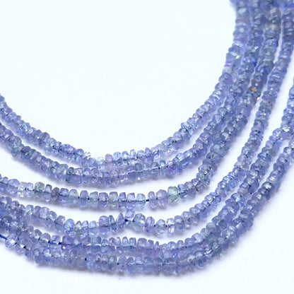 Natural tanzanite strand with faceted rondelles showing bright blue‑violet tones.