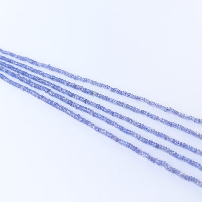 Vibrant violet‑blue tanzanite beads in faceted rondelle cut, perfect for gemstone beads for DIY jewellery projects.