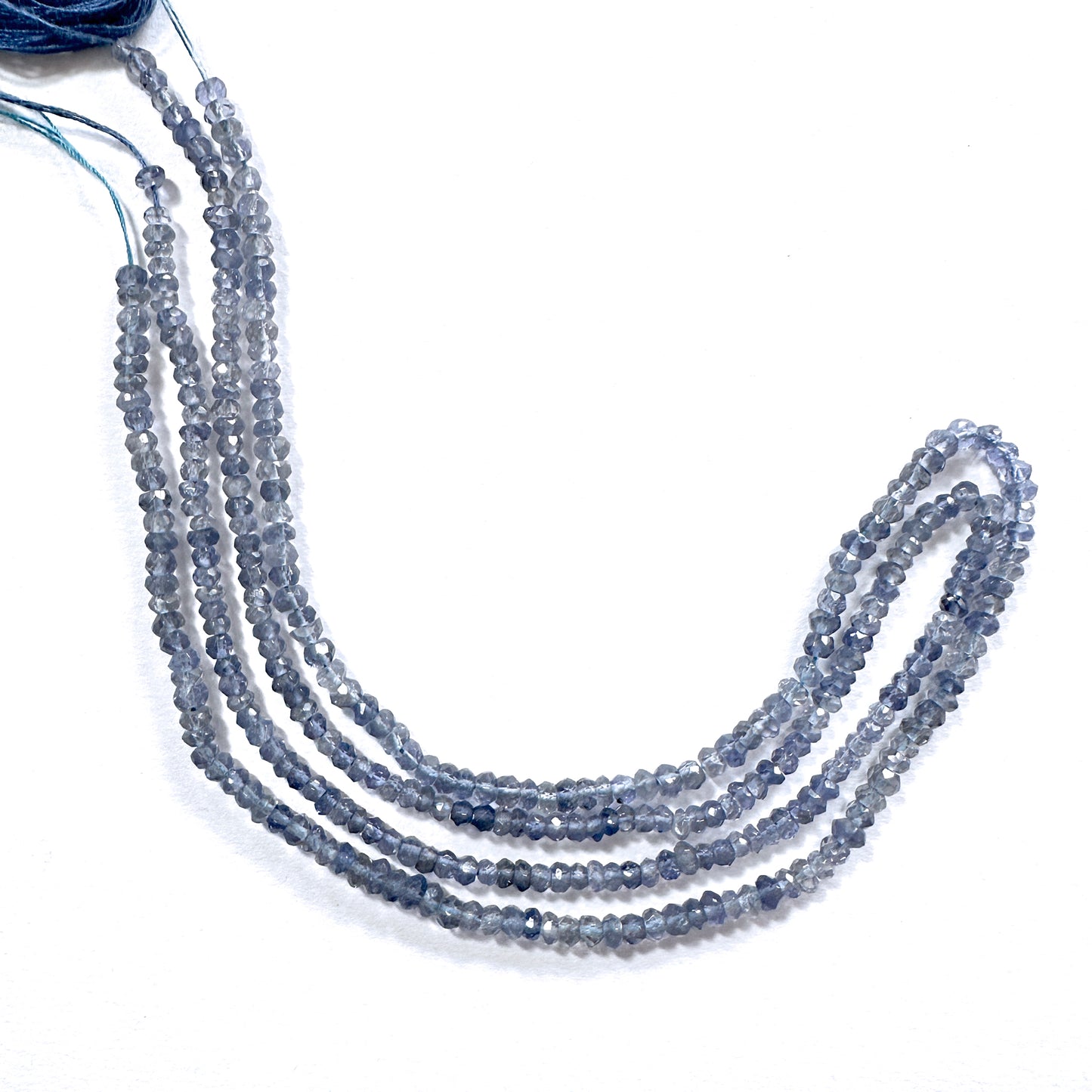 High-grade tanzanite rondelle beads in 3.5mm size, arranged in a luminous strand.