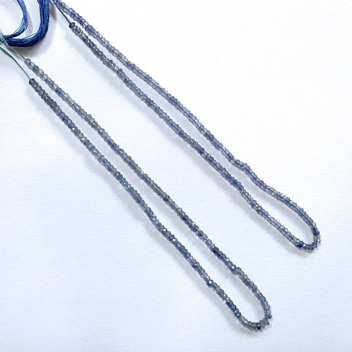 Tanzanite gemstone beads in rondelle cut shimmer with high clarity and consistent sizing.