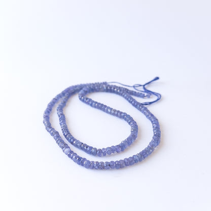 Sparkling Tanzanite faceted rondelle beads in mixed 4.1–6.2mm sizes for handmade jewellery components.