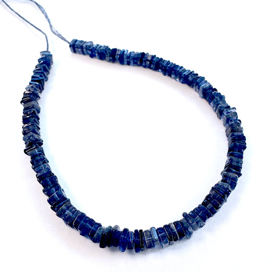 Tanzanite square heishi natural gemstone beads with vibrant violet-blue tones on a 20cm strand.