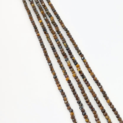 Tiger Eye micro faceted rondelle beads in 2.2 or 2.5mm size arranged neatly for DIY jewellery making.