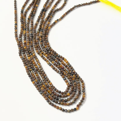 Stone beads for DIY jewellery featuring polished Tiger Eye rondelles with bright sparkle and even sizing.
