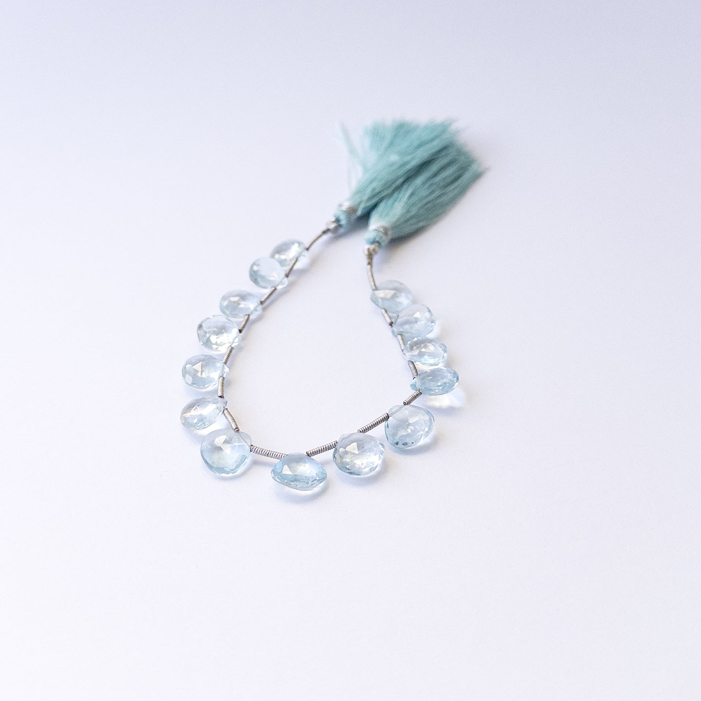 Authentic Topaz gemstone beads featuring sparkling faceted briolette cuts ideal for DIY jewellery making.