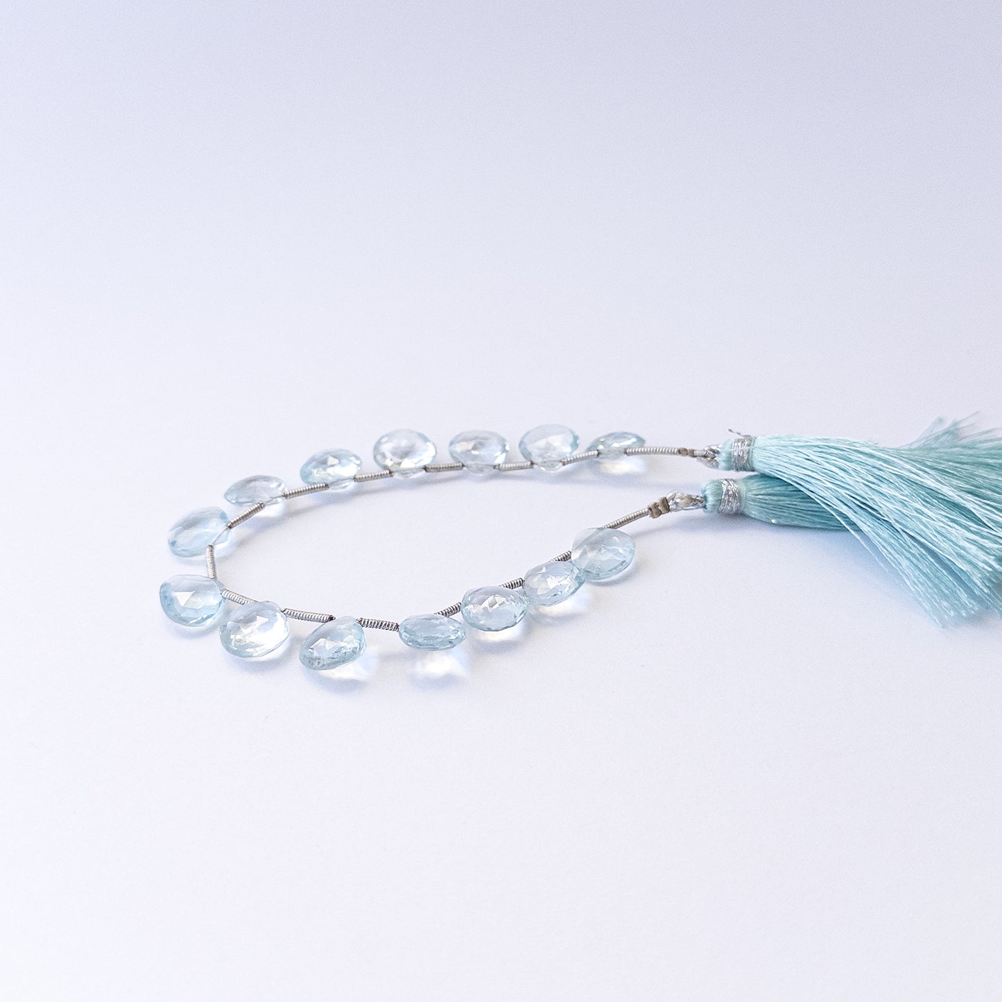 Topaz faceted briolette gemstone beads in 9.5–10mm sizes, genuine stone beads for handmade jewellery.