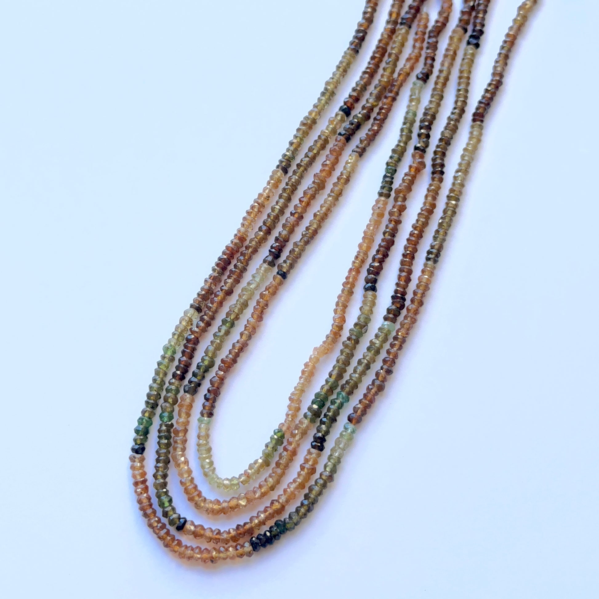 Strand of Tourmaline faceted rondelle beads 3–3.5mm ideal for layered necklaces and artisan DIY jewellery projects.