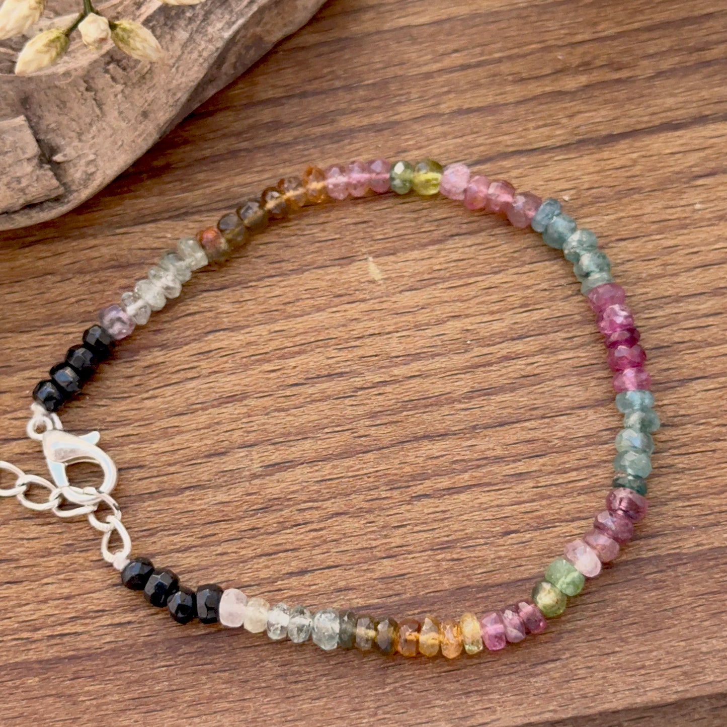 Tourmaline bracelet featuring faceted rondelle beads in bright multi‑colour tones.