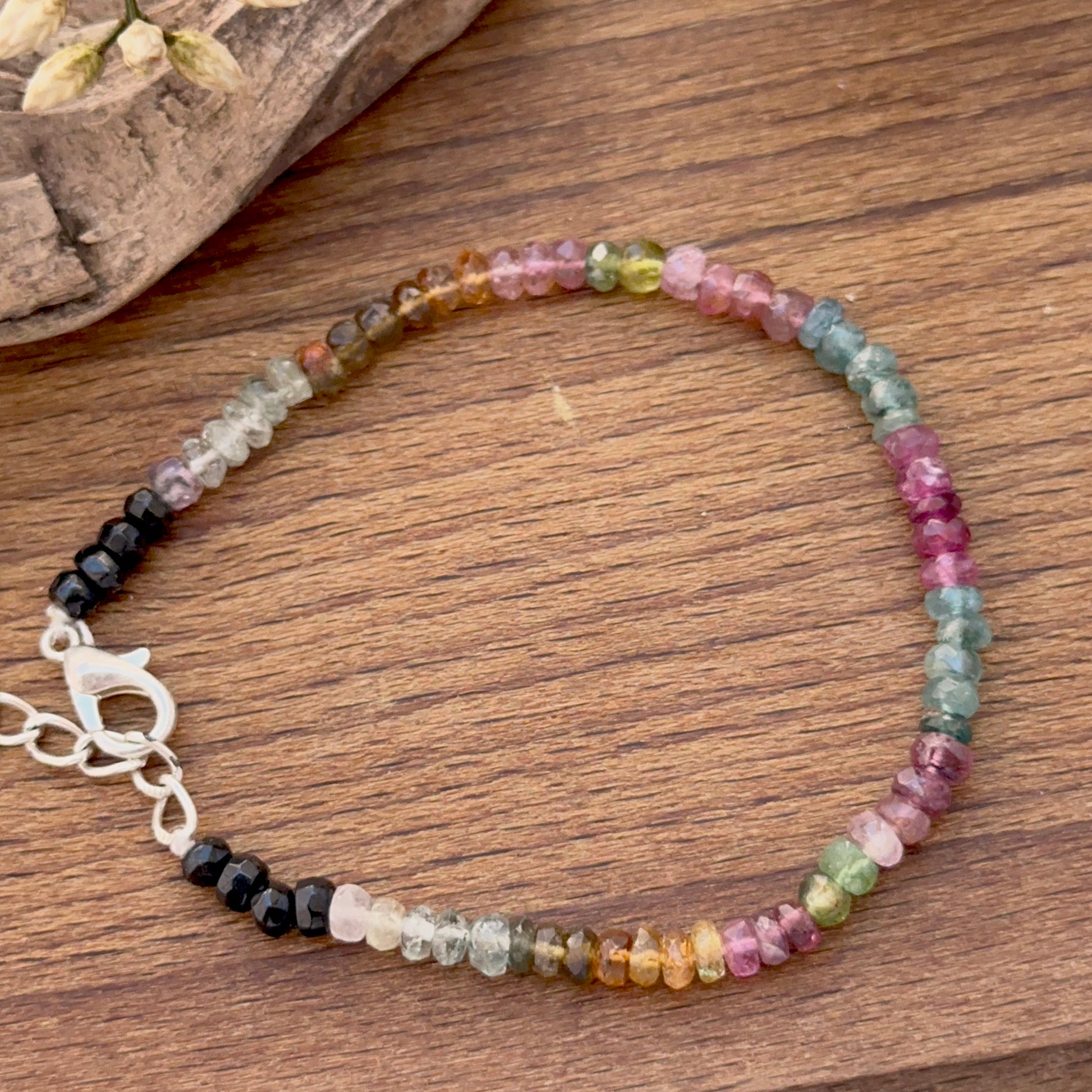 Tourmaline bracelet featuring faceted rondelle beads in bright multi‑colour tones.