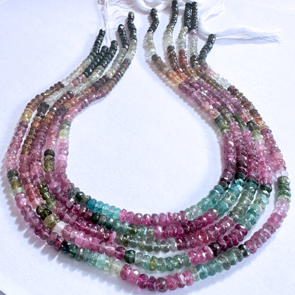 Close-up of Tourmaline gemstones with faceted rondelle cut, arranged in a 34cm strand with vibrant clarity and polish.