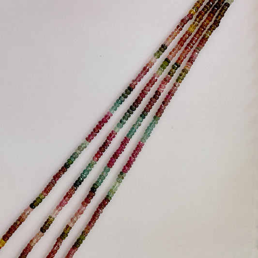 Tourmaline faceted rondelle beads in 4.3–4.5mm size featuring vibrant colours across a 34cm strand.