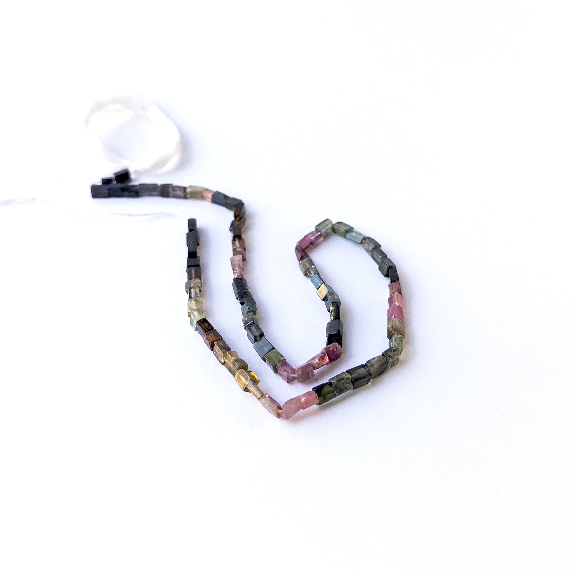 Tourmaline smooth rectangle gemstone beads arranged on a 36cm strand for handmade jewellery components.