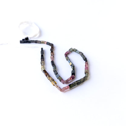 Tourmaline smooth rectangle gemstone beads arranged on a 36cm strand for handmade jewellery components.