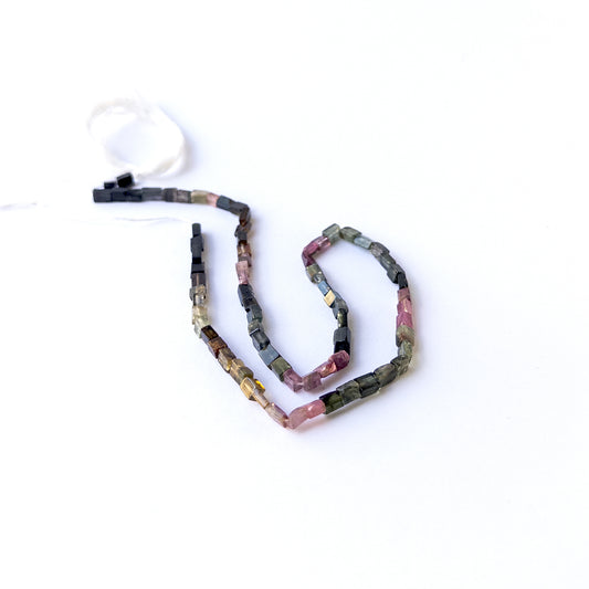 Tourmaline smooth rectangle gemstone beads arranged on a 36cm strand for handmade jewellery components.
