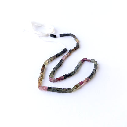 Genuine Tourmaline stone beads in smooth rectangle cut showcasing mixed natural colours and polished shine.