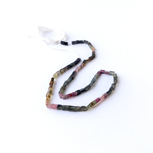 Genuine Tourmaline stone beads in smooth rectangle cut showcasing mixed natural colours and polished shine.