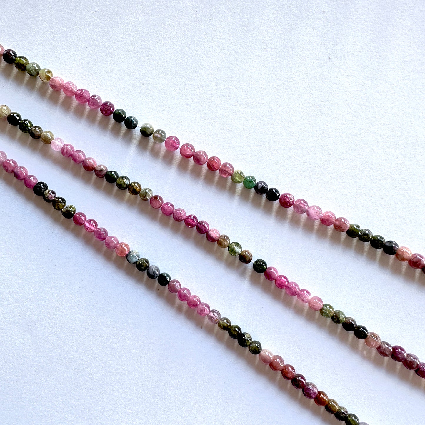 Australian gemstone bead supplier showcasing Tourmaline beads with 0.5mm drill holes and rich colour mix.
