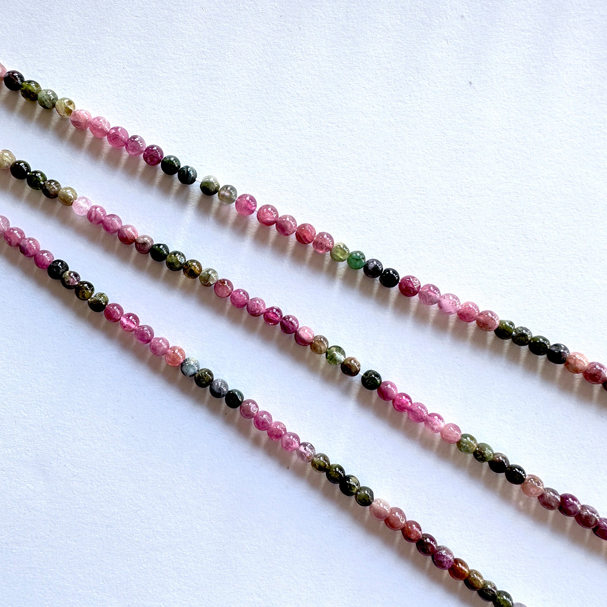 Australian gemstone bead supplier showcasing Tourmaline beads with 0.5mm drill holes and rich colour mix.