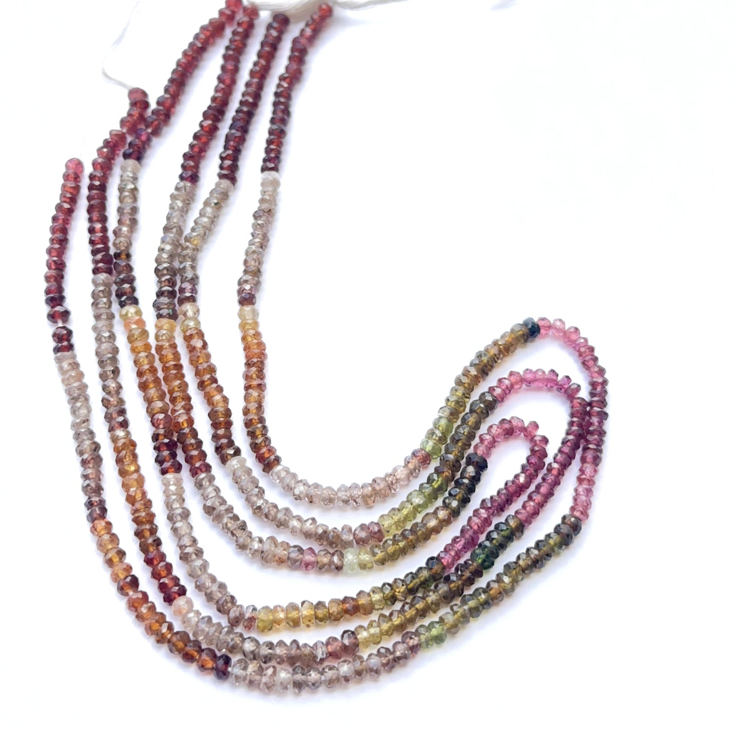 Tundra sapphire strand featuring multi‑tone beads arranged in a polished layout.