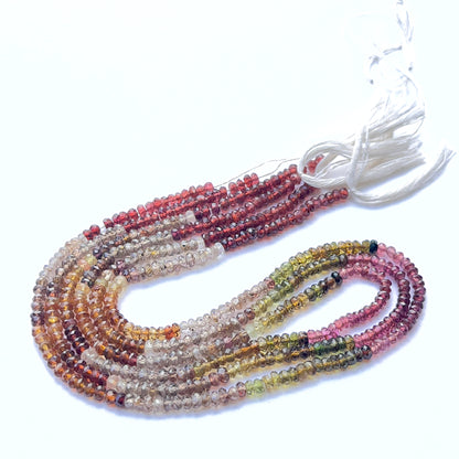 Tundra sapphire featuring faceted rondelle beads with earthy multi‑tone colours.