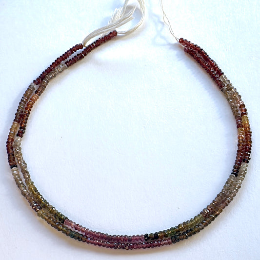 Tundra Sapphire faceted rondelle beads in 3.5mm size arranged in a 33cm strand with earthy tones and subtle sparkle.