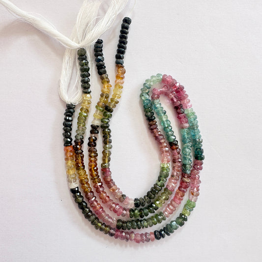 Faceted rondelle Watermelon Tourmaline beads in 3.5-4mm size, showcasing vibrant pink and green hues with high shine.
