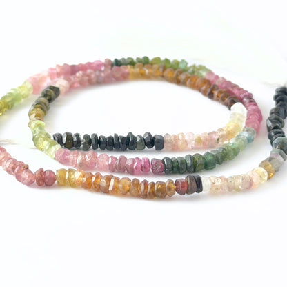 Close view of Watermelon Tourmaline faceted rondelle beads showing cut, clarity and vibrant colour variation.