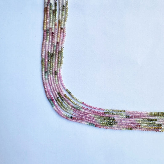 Natural watermelon tourmaline gemstone beads in faceted rondelle shape, glowing with radiant colour.