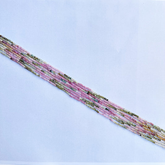 Beautifully aligned watermelon tourmaline beads exhibiting consistent cut and high gemstone quality.