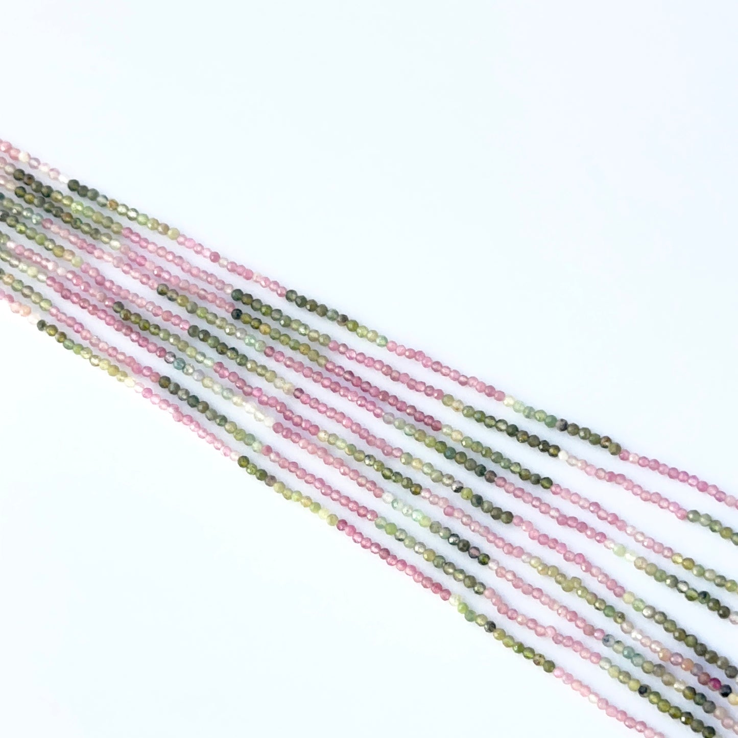 Watermelon Tourmaline 2.0–2.3mm rondelle beads displaying natural colour zoning and handmade jewellery components.