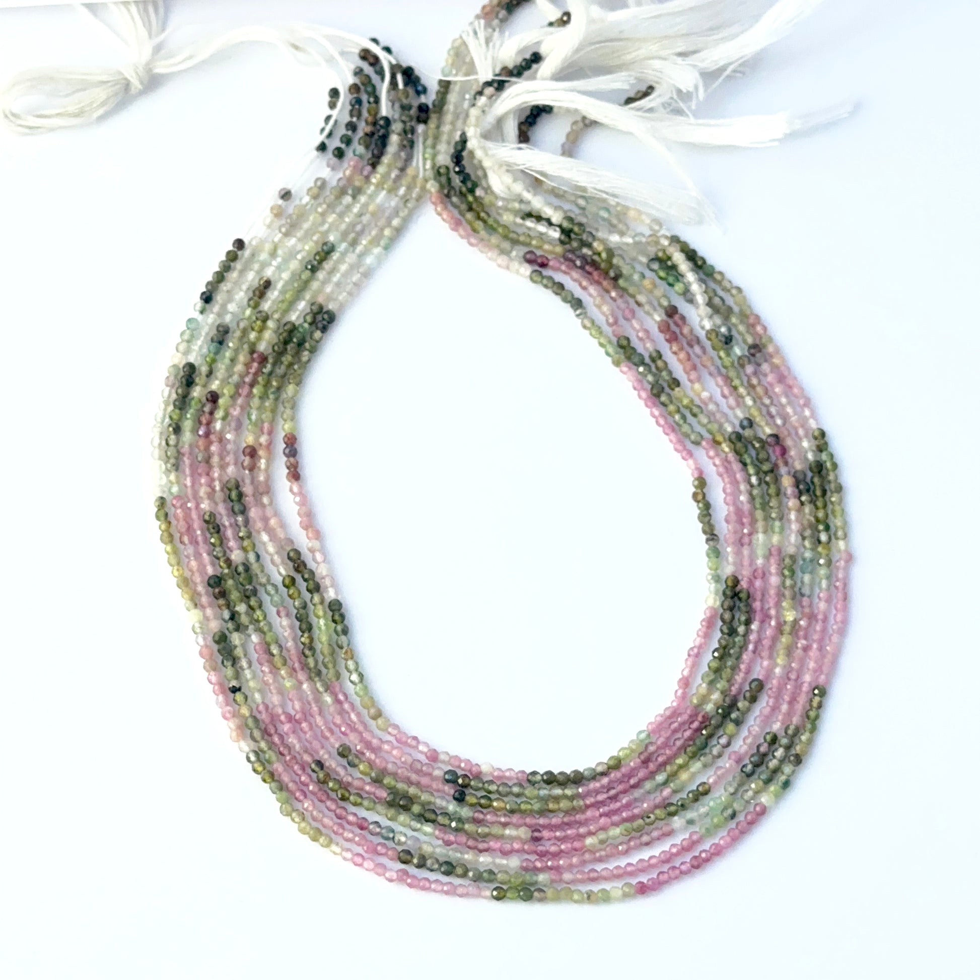 Watermelon Tourmaline faceted rondelle beads showing mixed pink and green tones with crisp cuts.