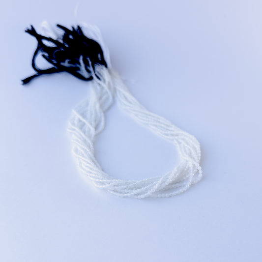 Natural White Chalcedony faceted rondelle stone beads 2.1mm displayed neatly for DIY jewellery and authentic gemstone designs.
