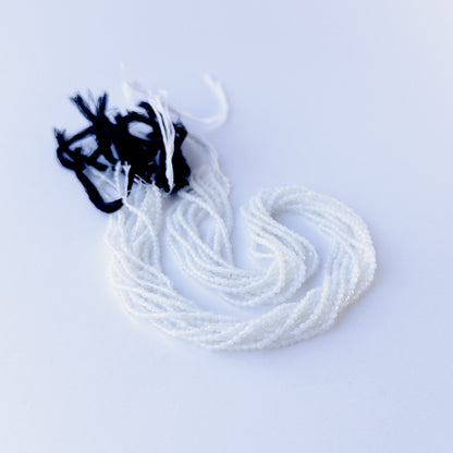 Handmade jewellery components featuring authentic White Chalcedony faceted rondelle beads with soft white sparkle.