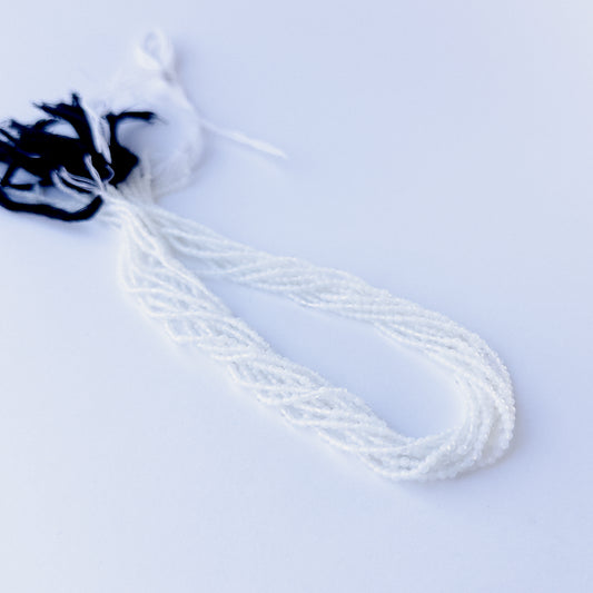 White Chalcedony faceted rondelle 2.1mm genuine gemstone beads arranged in a bright 31cm strand for handmade jewellery.
