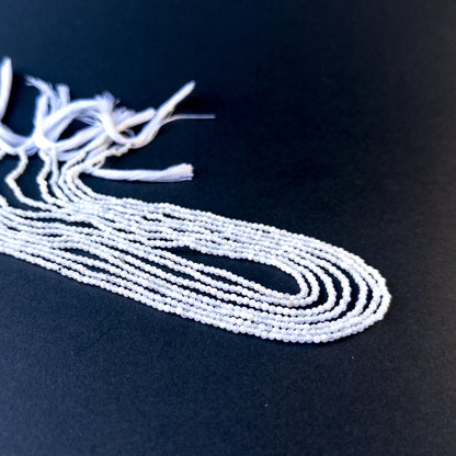 Genuine stone beads with soft white tones and subtle fire, featuring faceted rondelles for DIY jewellery making.