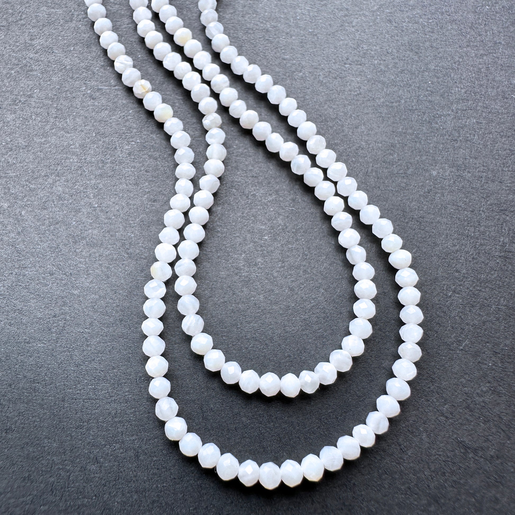 Natural gemstone beads in White Opal, 2.4mm size, ideal for delicate DIY jewellery designs.