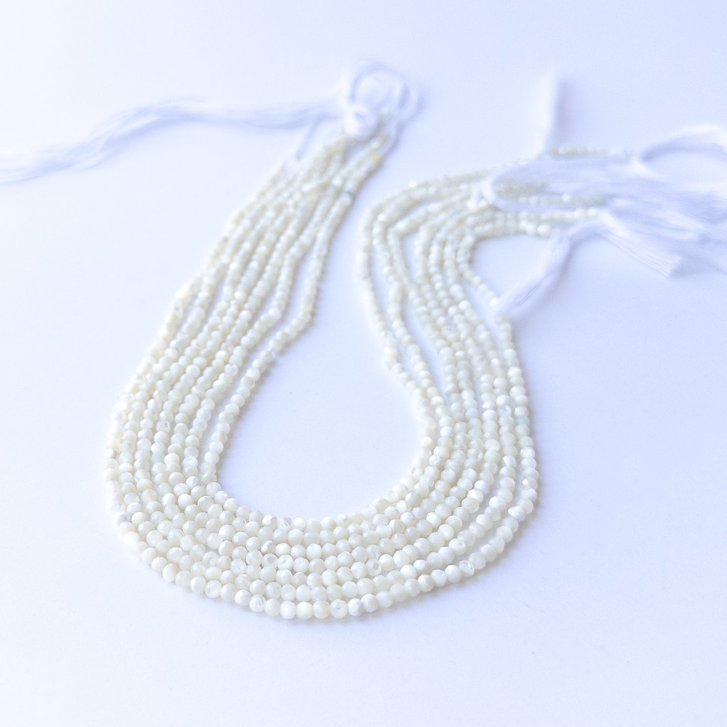 White Opal faceted rondelle beads in 3mm size on a 31cm strand, showcasing genuine gemstone sparkle for handmade jewellery.