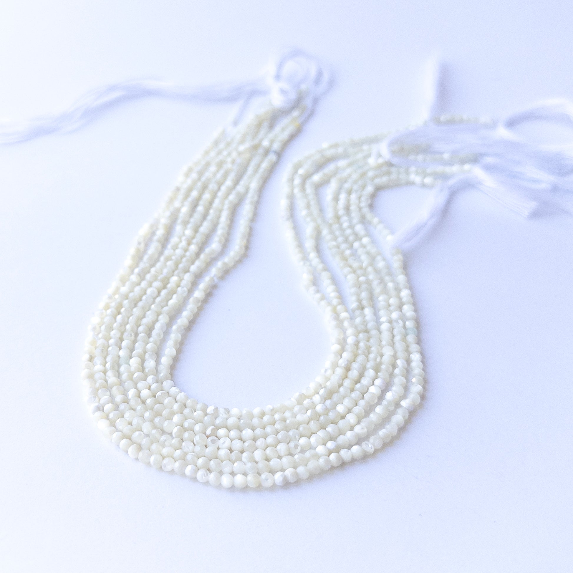 White Opal faceted rondelle beads in 3mm size on a 31cm strand, showcasing genuine gemstone sparkle for handmade jewellery.