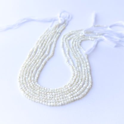 White Opal faceted rondelle beads in 3mm size on a 31cm strand, showcasing genuine gemstone sparkle for handmade jewellery.