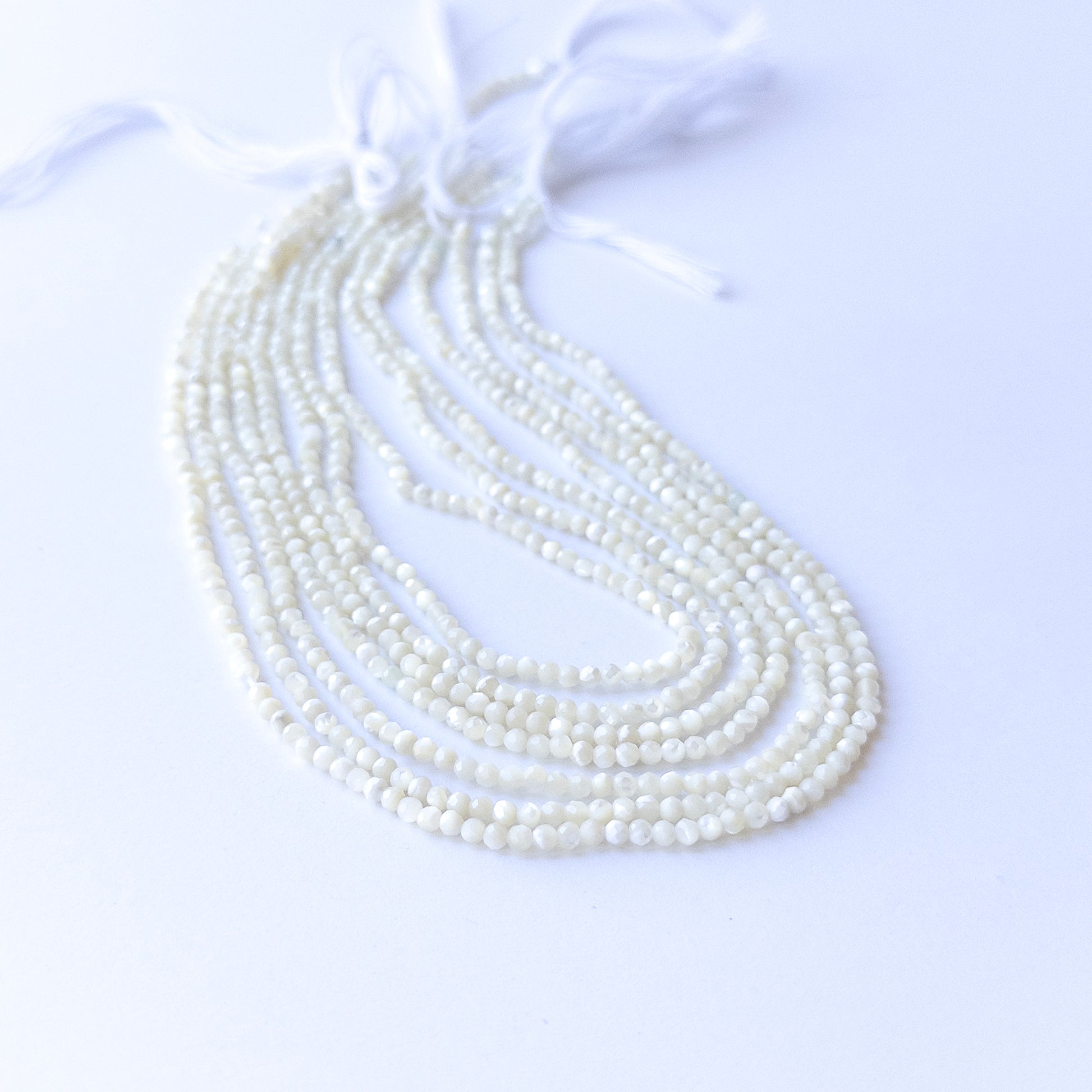 Authentic White Opal stone beads with faceted rondelle cut, ideal for DIY jewellery makers seeking premium gemstone components.