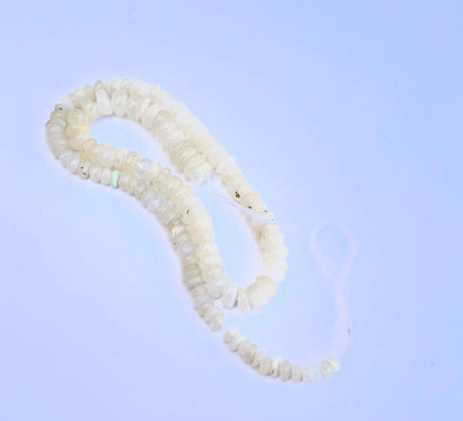Stone beads arranged on a 20cm strand showcasing polished finish and gentle shine.