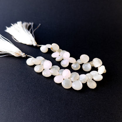 Genuine stone beads with soft white tones and rainbow flashes, featuring faceted briolettes for DIY jewellery making.